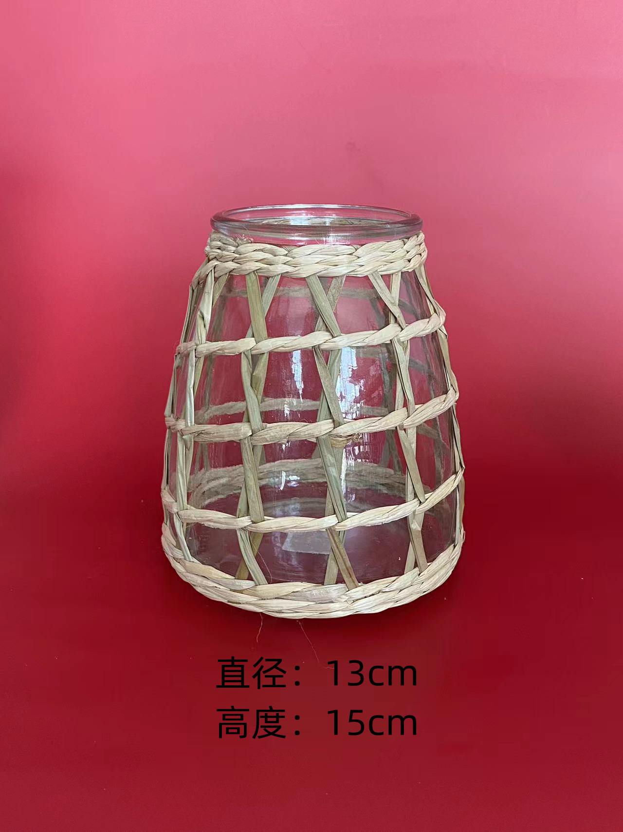 A braided glass vase made of straw