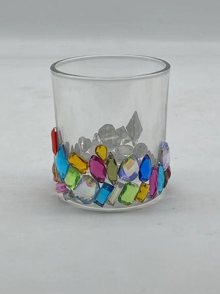 A sequined column glass votive candle holder for Christmas celebrations